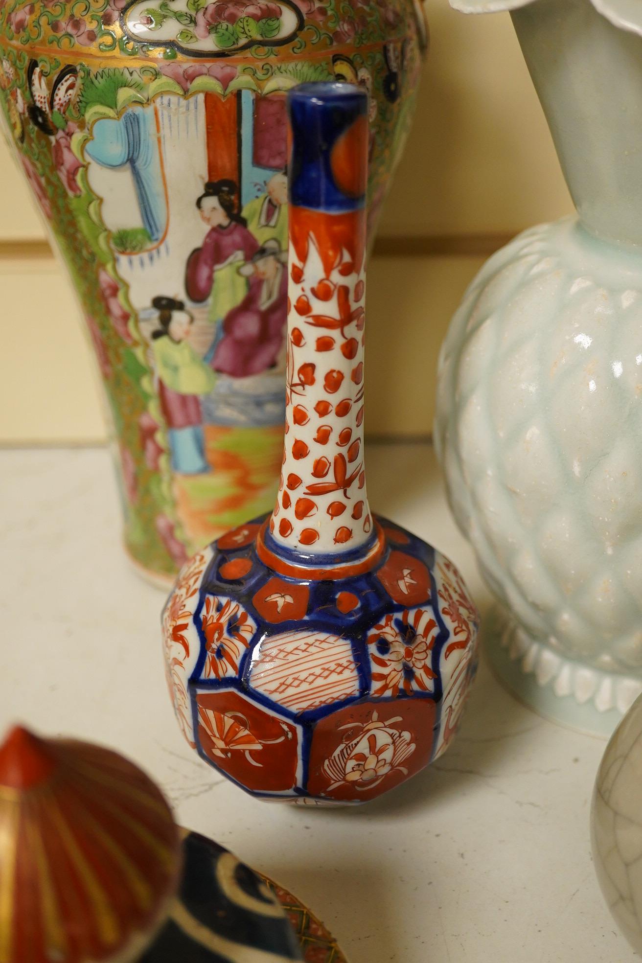 A Chinese Canton pattern vase, crackle glazed bottle vase, pale green vase, a Japanese Imari bottle vase and another cover, famille rose vase 24cm high. Condition - poor to good